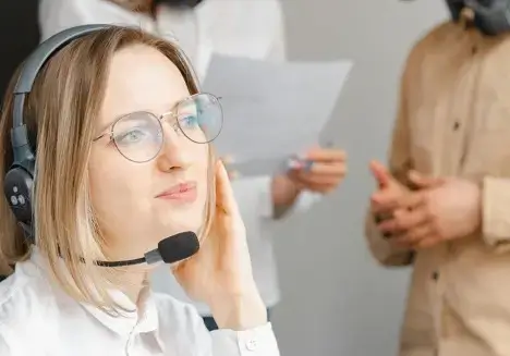 woman with headset in customer service center