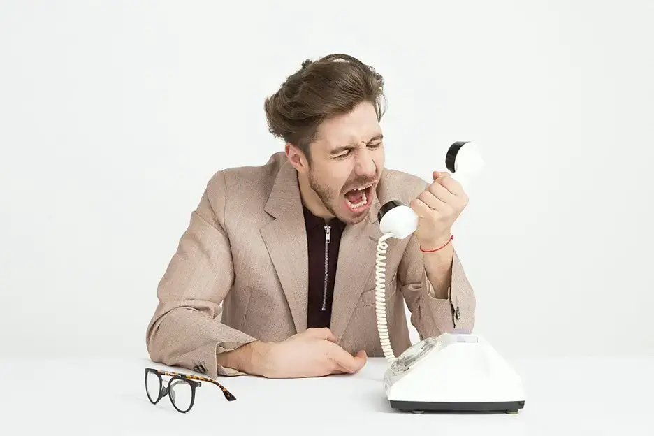 Stressed, angry customer shouting on the phone