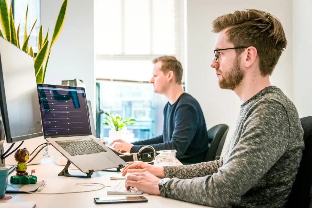 man at desk on computer