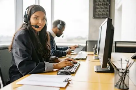 Customer service agent working at her desk