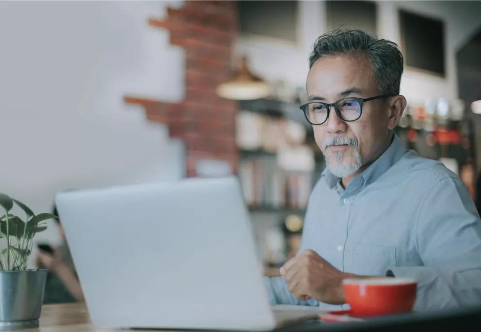 A man looking at his computer.